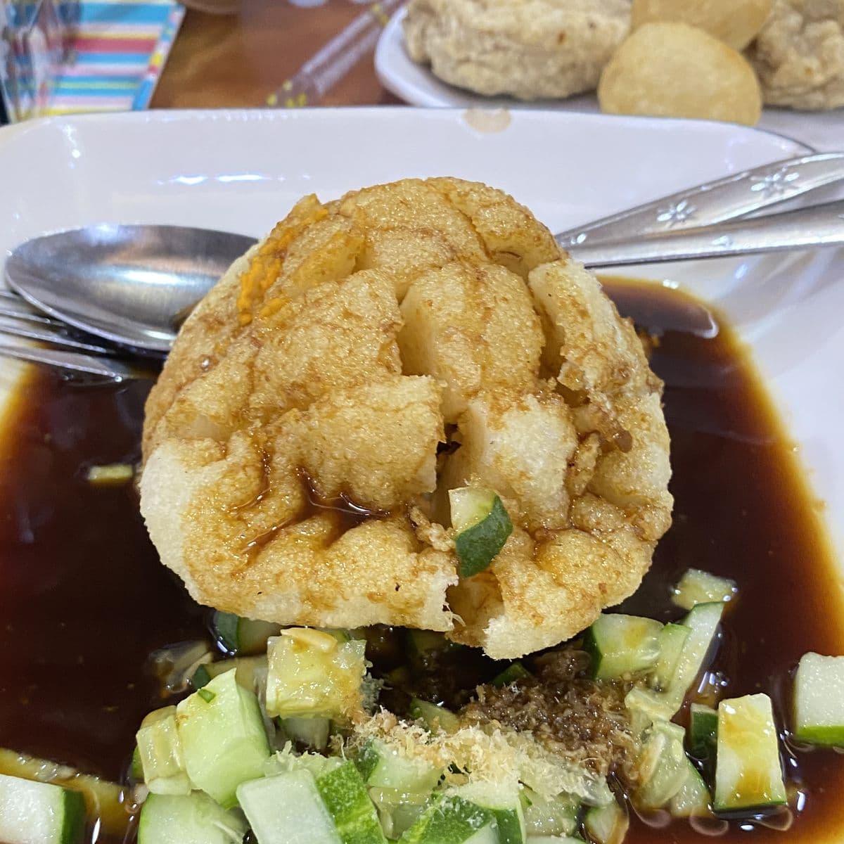 A plate of kapal selam pempek in cuko sauce